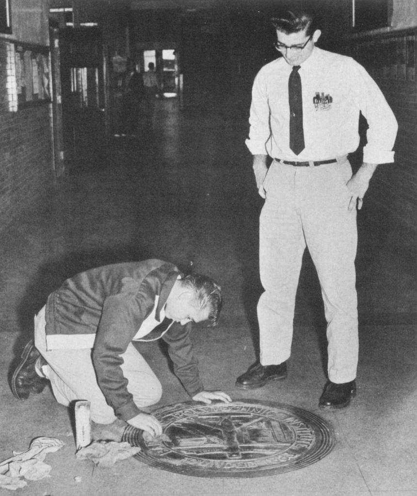 Poly 1955 cleaning the school seal